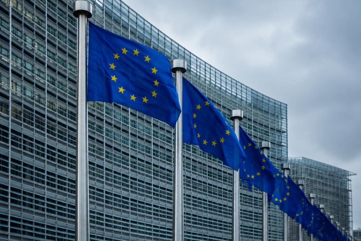European Union flags in front of a modern institutional building